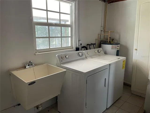 a utility room with dryer and washer