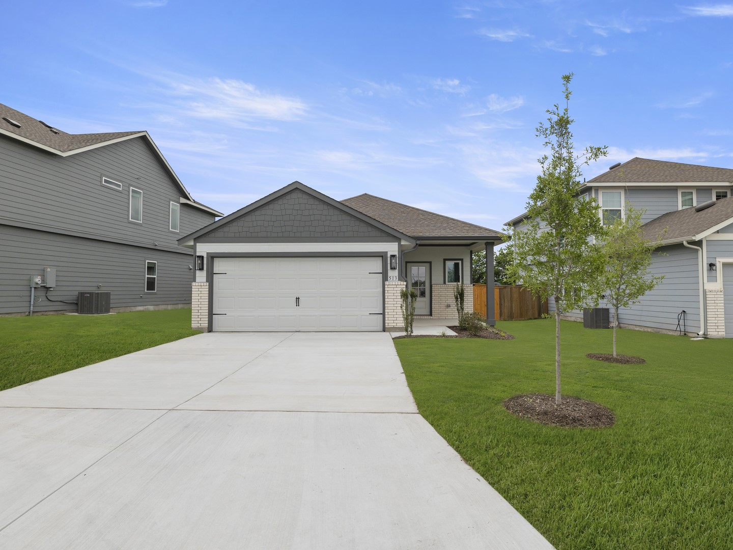513 Yellow Ribbon Trail Jarrell, TX 76537 - Photo 1 of 23 A well-maintained lawn and extended driveway welcome you to this charming single-story residence.