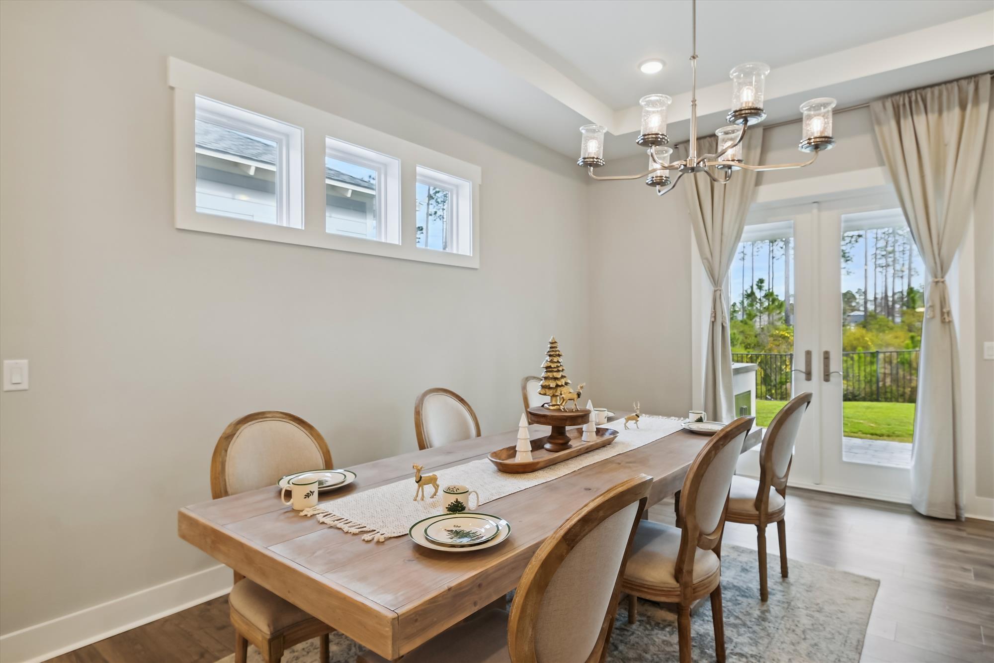236 Naturewalk Blvd Inlet Beach Inlet Beach, FL 32461 - Photo 11 of 38 a view of a dining room with furniture wooden floor and chandelier