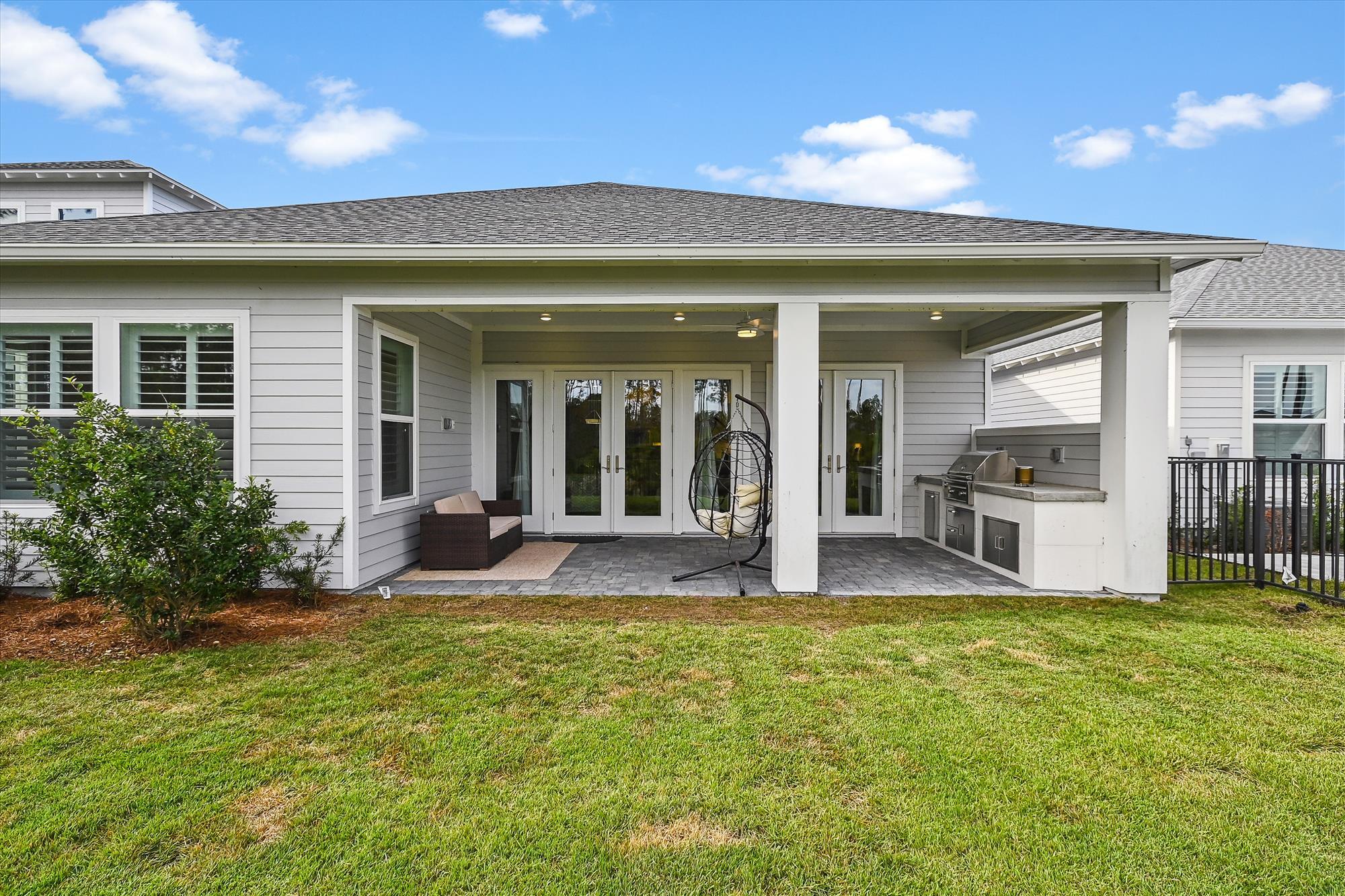 236 Naturewalk Blvd Inlet Beach Inlet Beach, FL 32461 - Photo 17 of 38 a view of a house with backyard porch and sitting area