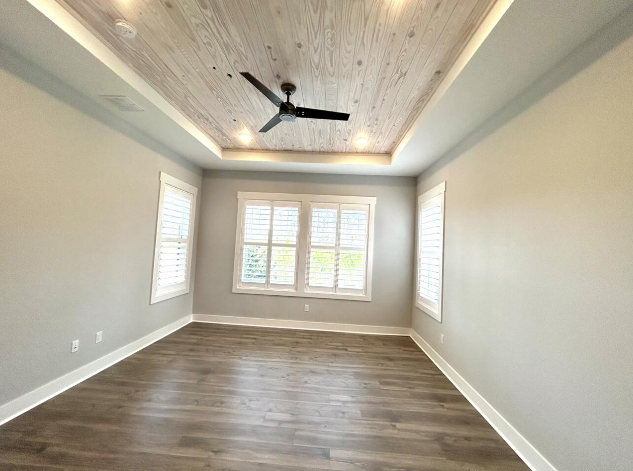 236 Naturewalk Blvd Inlet Beach Inlet Beach, FL 32461 - Photo 23 of 38 a view of an empty room with wooden floor and a window