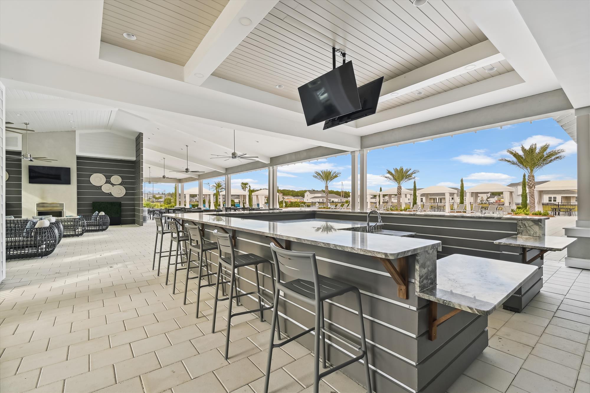 236 Naturewalk Blvd Inlet Beach Inlet Beach, FL 32461 - Photo 37 of 38 a dining hall with stainless steel appliances kitchen island granite countertop a table and chairs in it