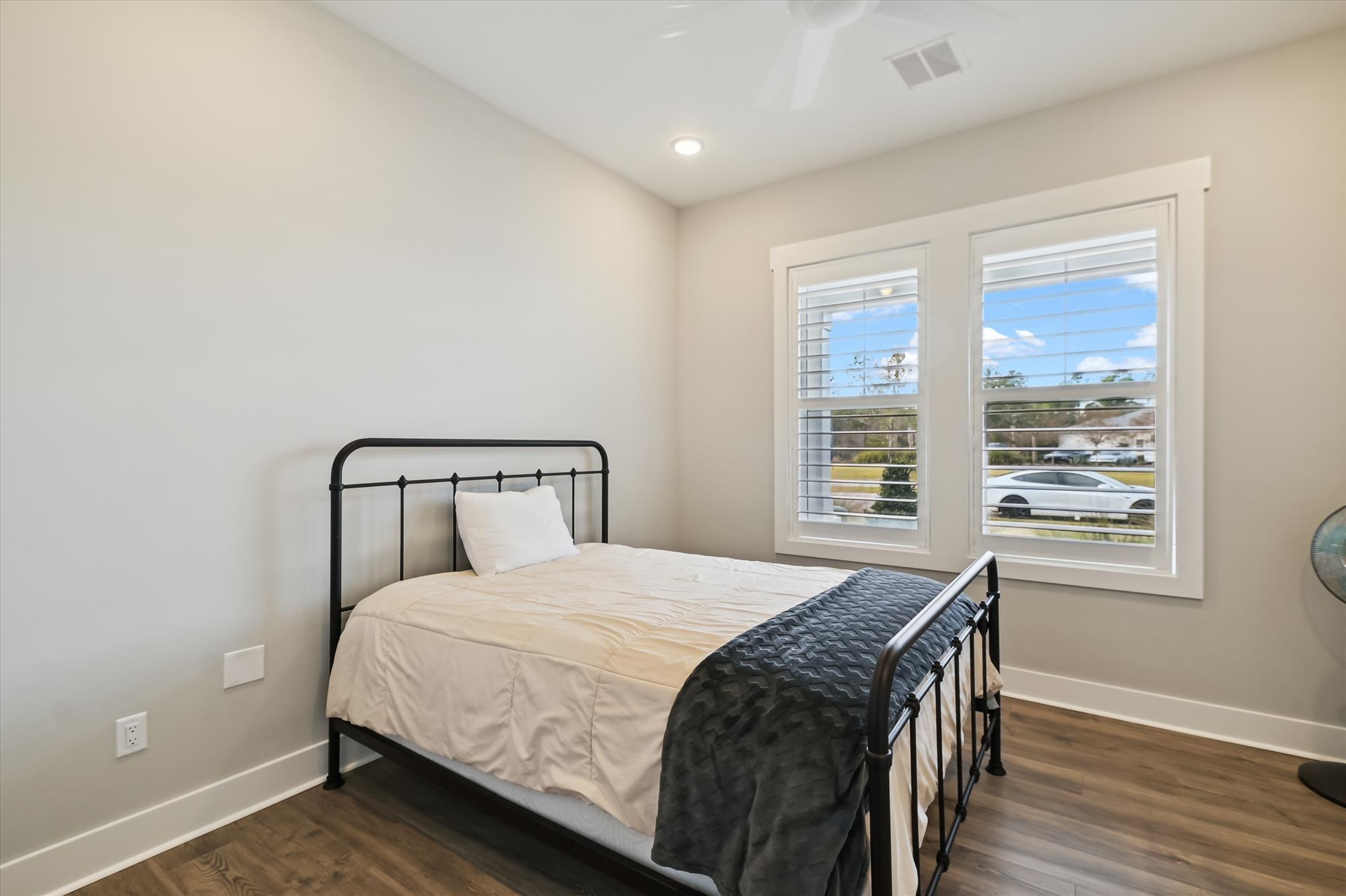 236 Naturewalk Blvd Inlet Beach Inlet Beach, FL 32461 - Photo 5 of 38 a bedroom with a bed and wooden floor
