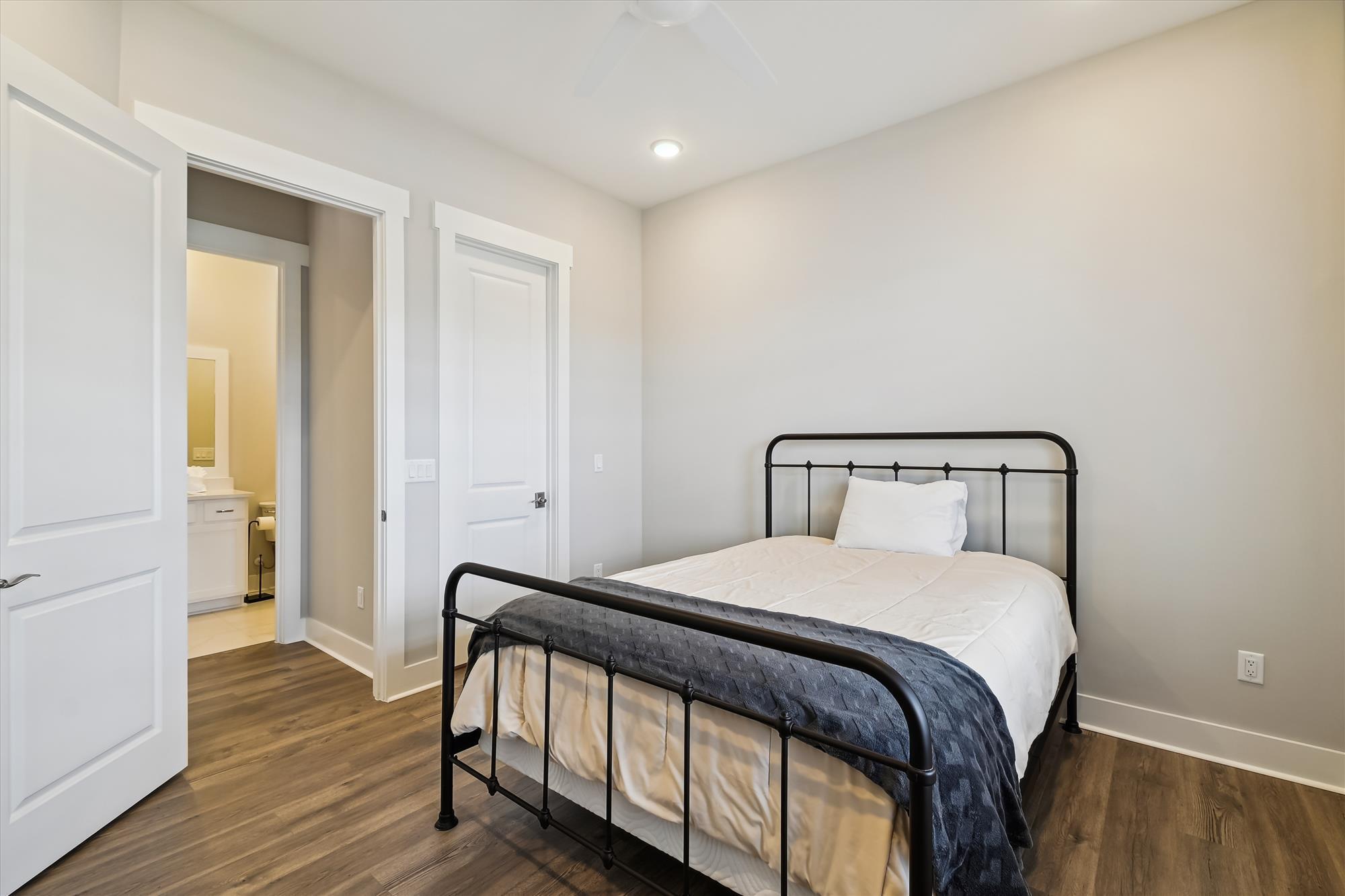 236 Naturewalk Blvd Inlet Beach Inlet Beach, FL 32461 - Photo 6 of 38 a bedroom with a bed and wooden floor