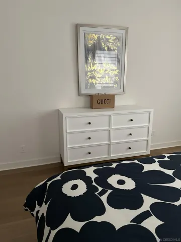 a bed room with a bed and a window