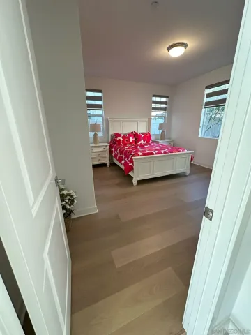 a view of patio with couches and potted plants