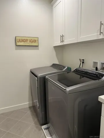 a spacious bedroom with a bed and a couch in it