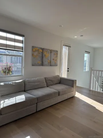 a living room with furniture and a large window