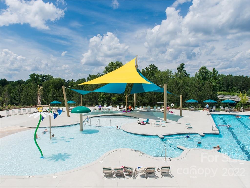 6520 Gopher Road, Unit 322 Lancaster, SC 29720 - Photo 14 of 25 a view of a swimming pool with outdoor seating