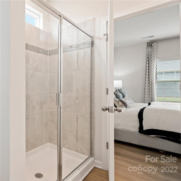 6520 Gopher Road, Unit 322 Lancaster, SC 29720 - Photo 10 of 25 a bedroom with a bed and a window