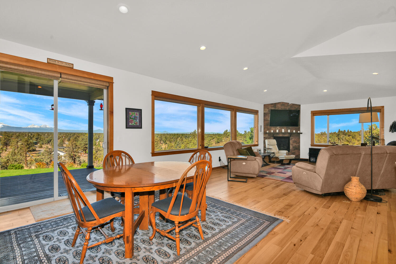 62860 Deschutes Road Bend, OR 97701 - Photo 11 of 34 Dining Room with wood floors. Door leads out to the covered outdoor living