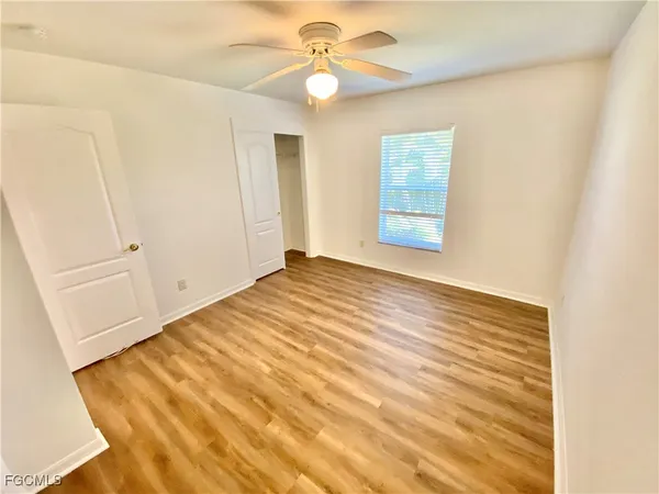 a view of an empty room and window