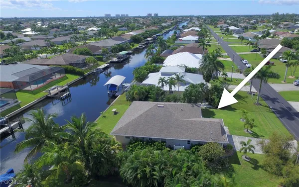 an aerial view of a house with a garden