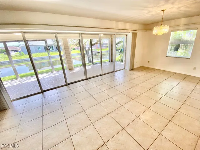 a view of an empty room and window