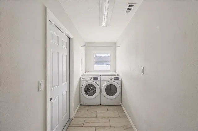 a utility room with dryer and washer