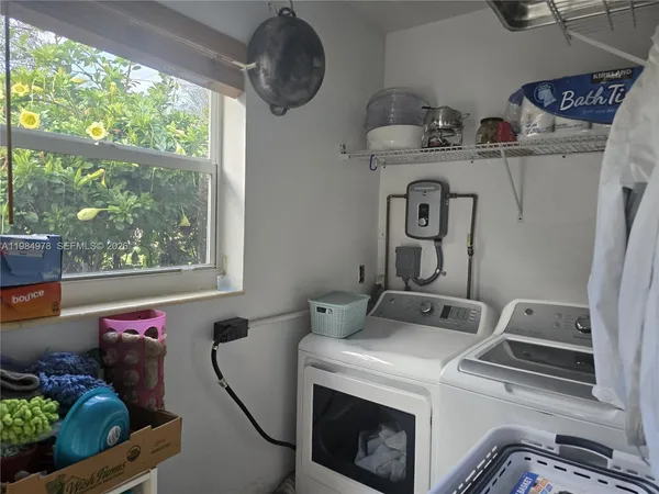 a utility room with dryer and washer