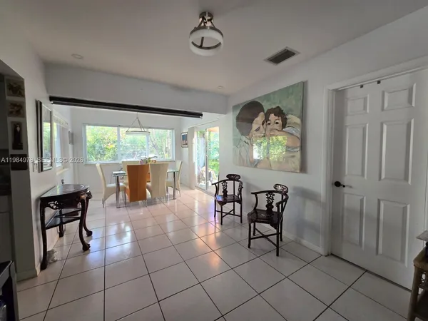 a view of a livingroom with furniture window and outside view