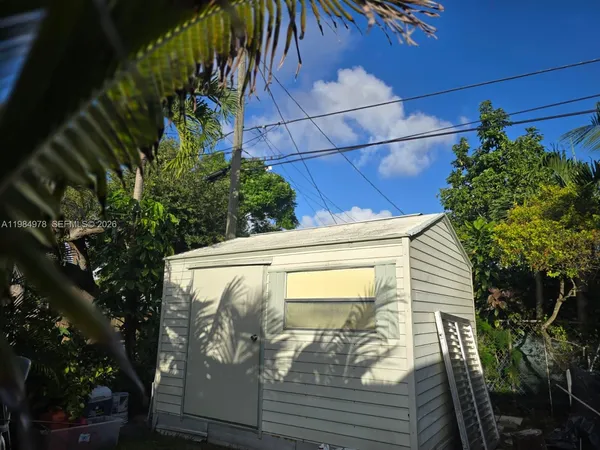 a view of a house with a tree