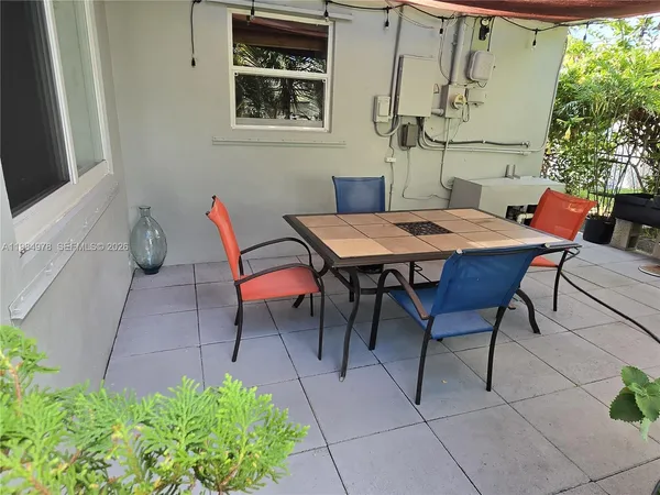 a outdoor dining space with furniture