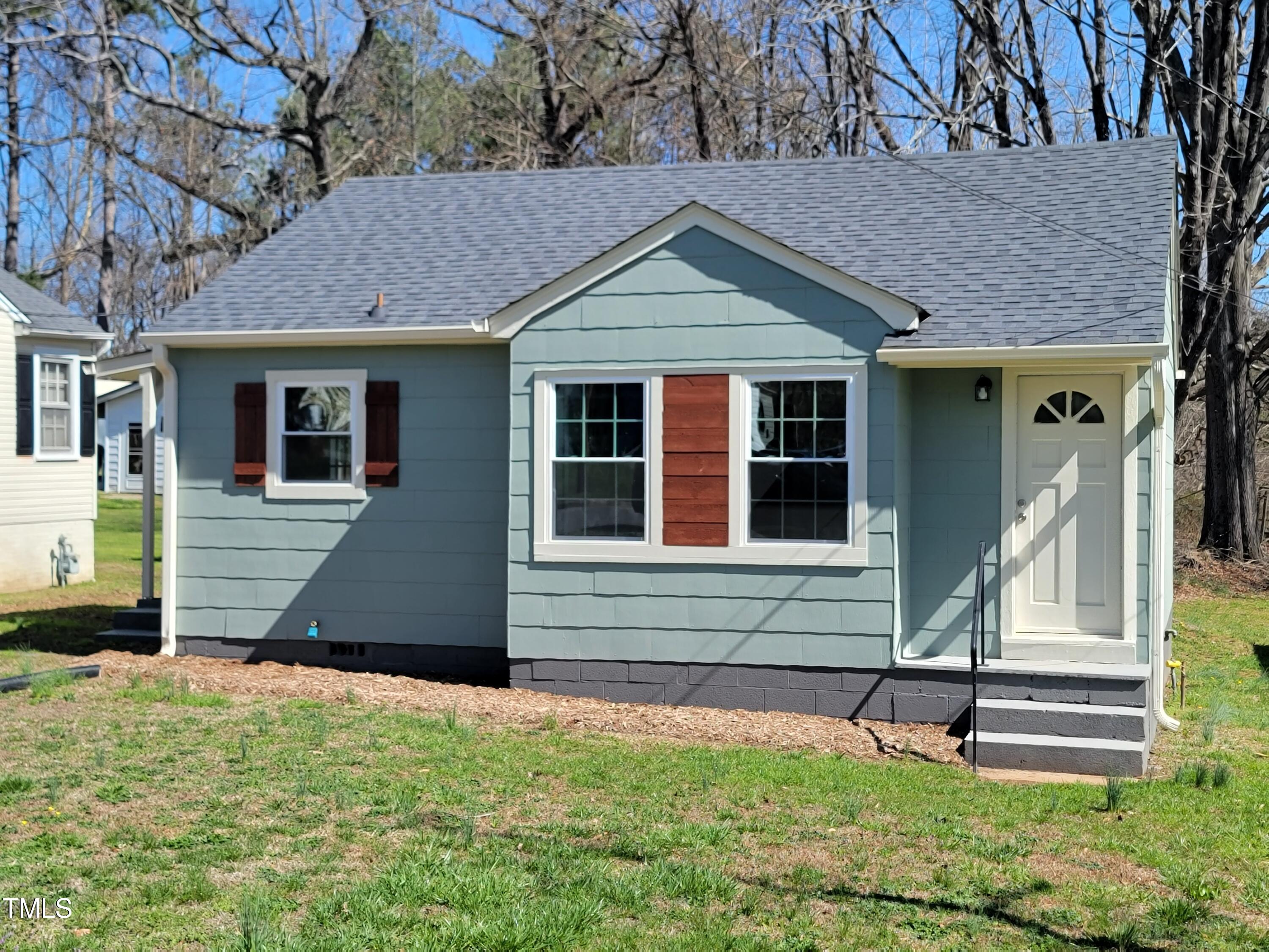 1250 Pointer Street Roxboro, NC 27573 - Photo 1 of 6 a front view of a house with a yard