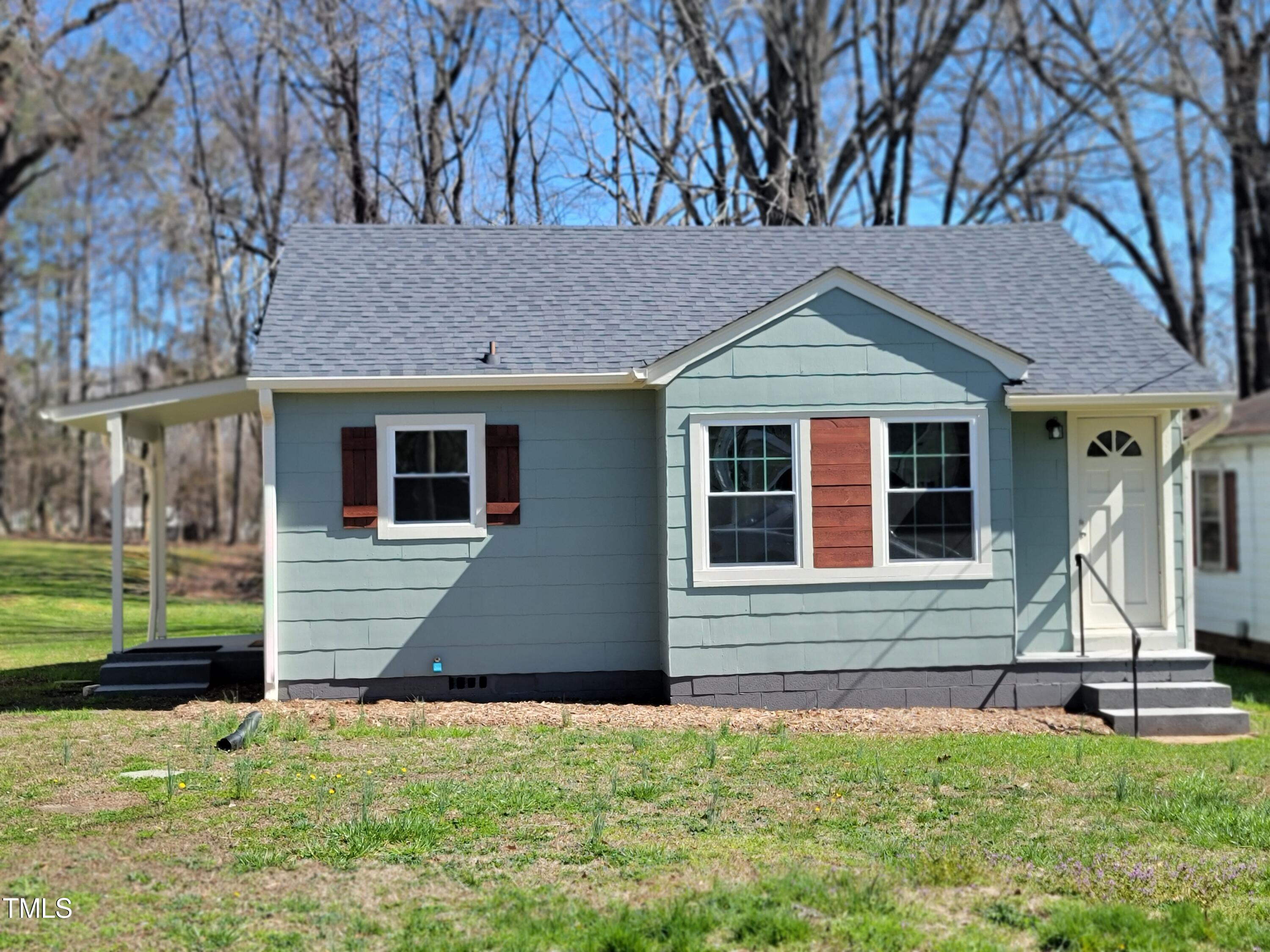 1250 Pointer Street Roxboro, NC 27573 - Photo 2 of 6 a front view of a house with a yard