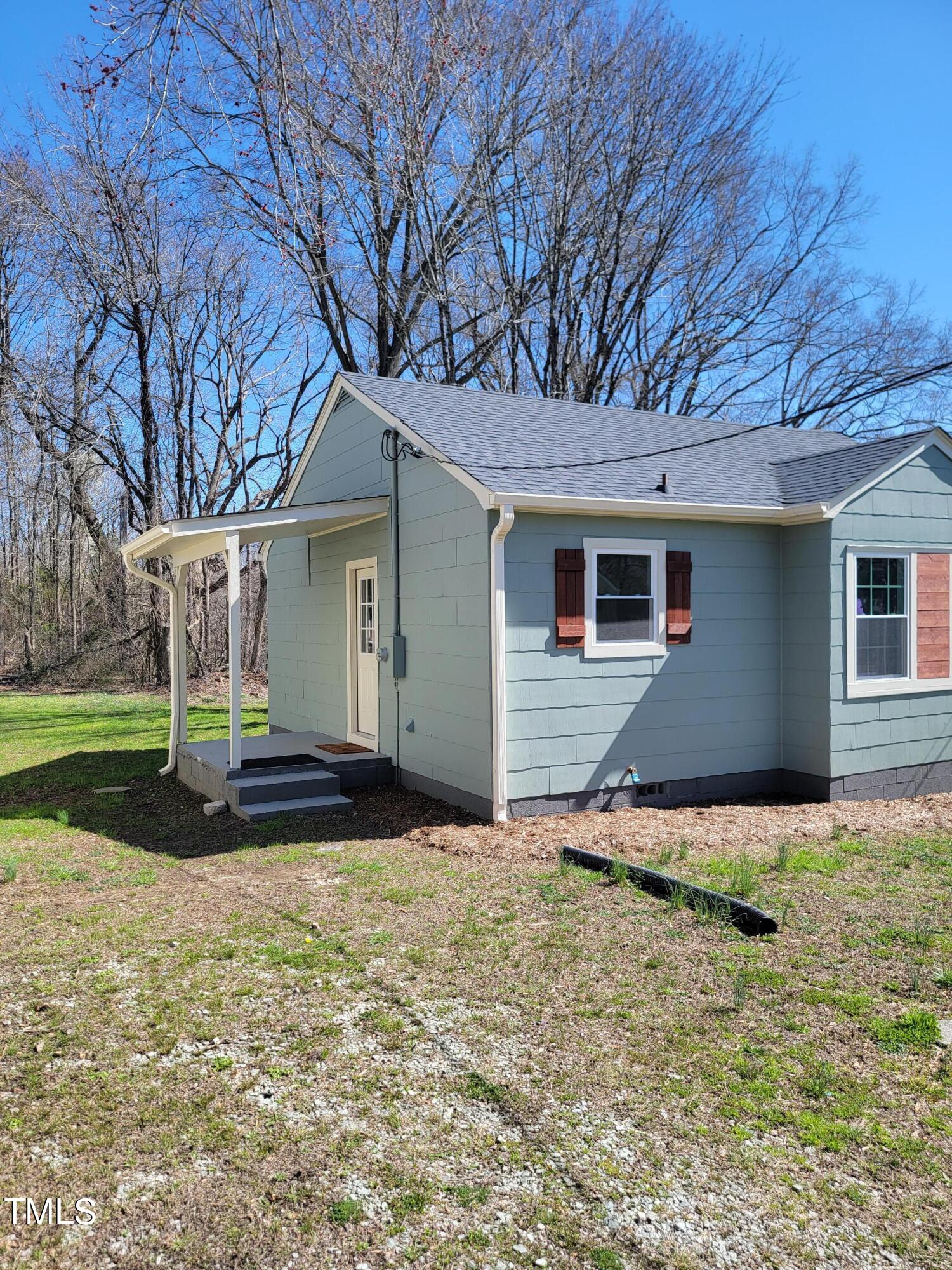 1250 Pointer Street Roxboro, NC 27573 - Photo 6 of 6 a view of a house with backyard and tree