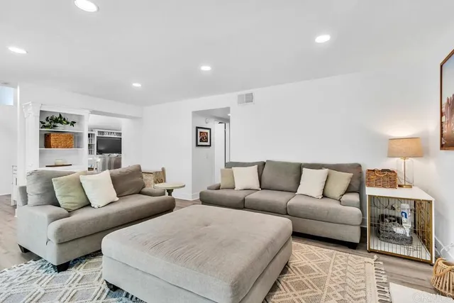 a bathroom with a shower sink and mirror
