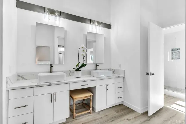 a view of a patio with a table and chairs under an umbrella