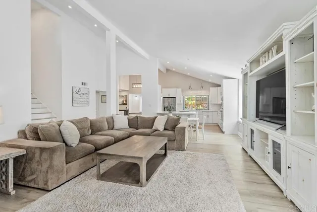 a large kitchen with a table and chairs in it