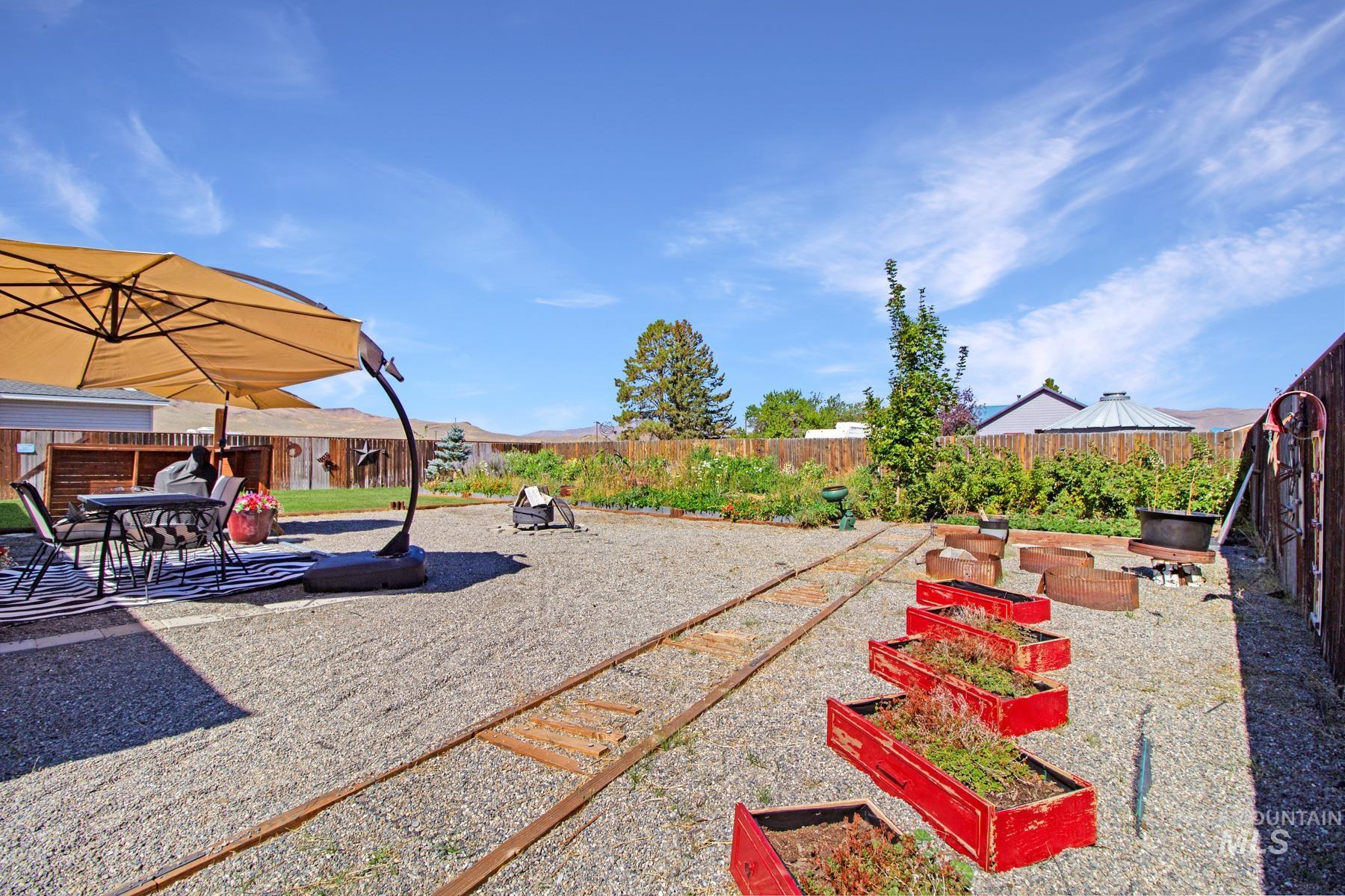 105 Greenfield Way Madison, MS 39110 - Photo 19 of 24 Fenced backyard featuring a patio and a vegetable garden
