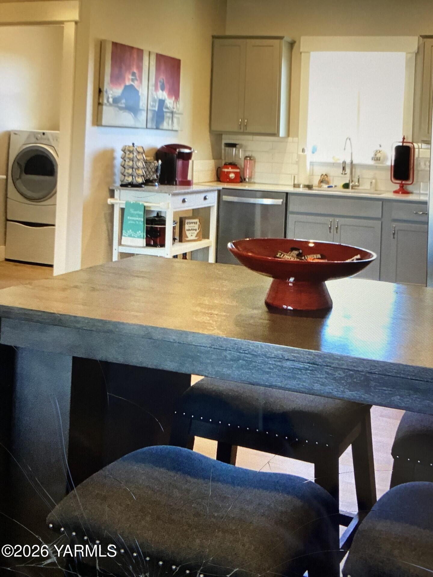 2600 Racquet Lane, Unit 36 Yakima, WA 98902 - Photo 2 of 5 a kitchen with a sink cabinets and window