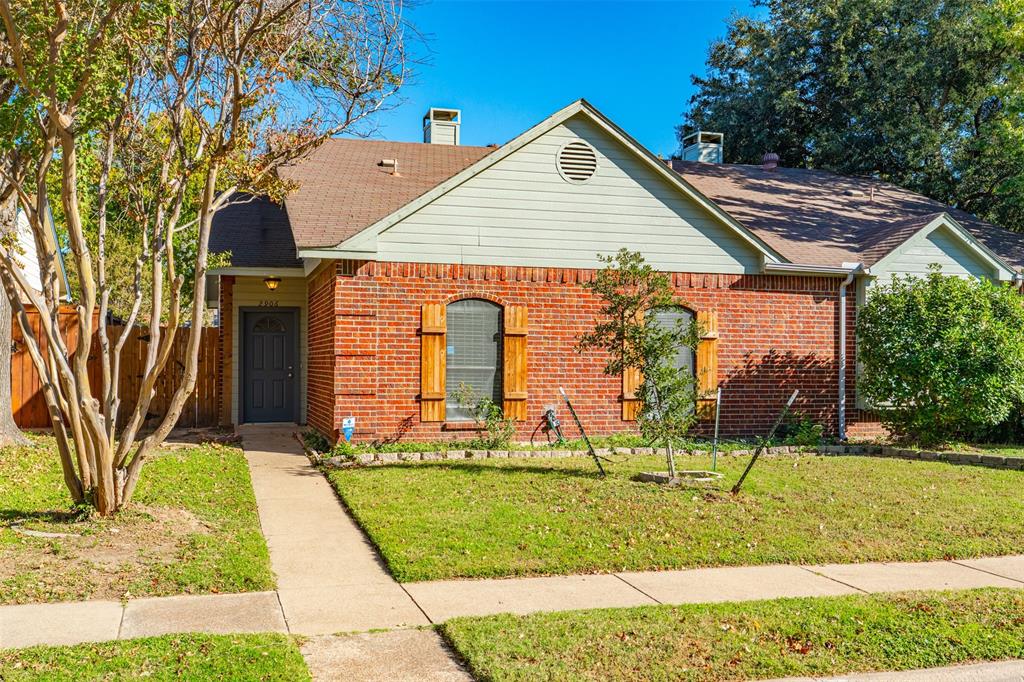 2906 Roxboro Road Euless, TX 76039 - Photo 1 of 23 a front view of a house with garden