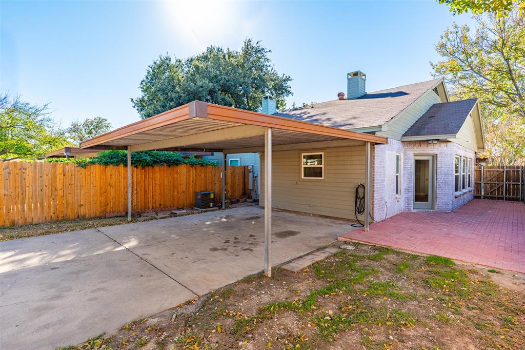 2906 Roxboro Road Euless, TX 76039 - Photo 20 of 23 a view of a house with backyard and trees