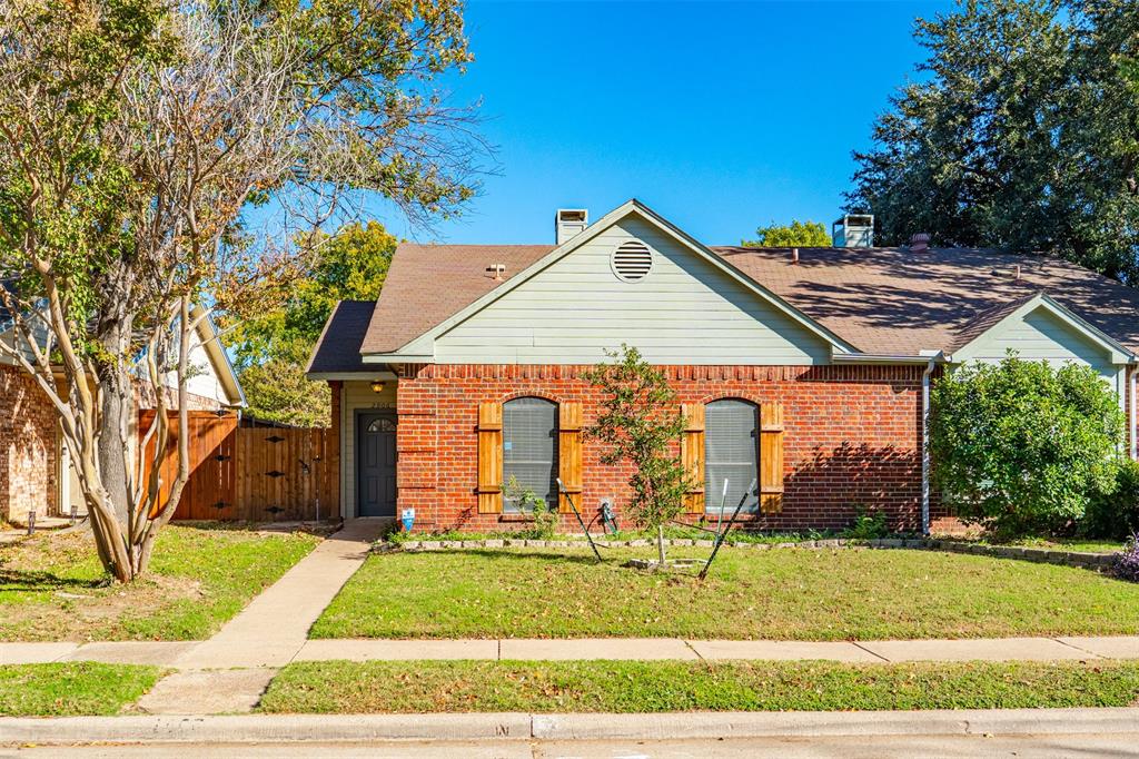 2906 Roxboro Road Euless, TX 76039 - Photo 2 of 23 a front view of a house with garden