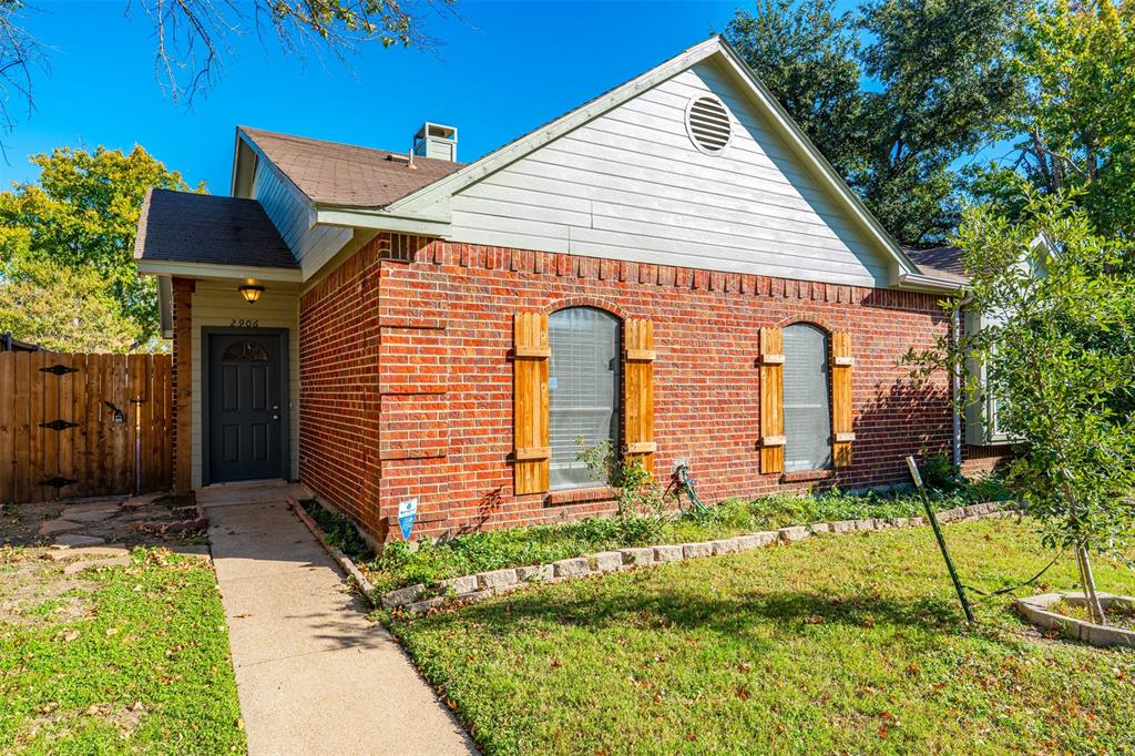 2906 Roxboro Road Euless, TX 76039 - Photo 3 of 23 a front view of a house with garden