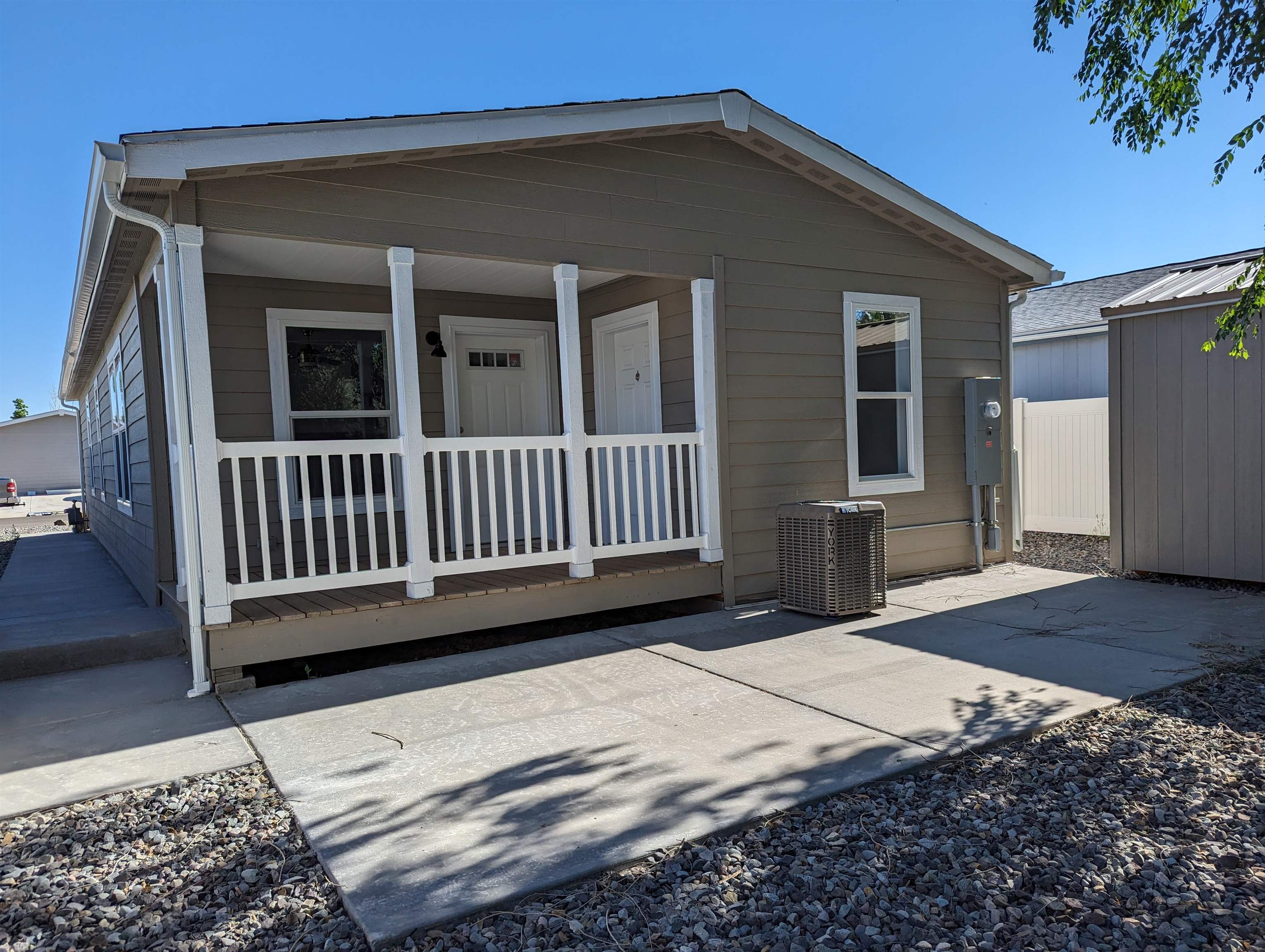a view of a house with wooden floor and a yard