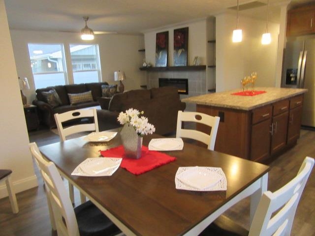 222 Holly Berry Way Fruita, CO 81521 - Photo 14 of 23 a living room with furniture and a dining table