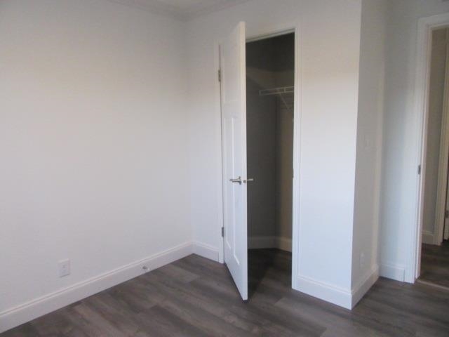 222 Holly Berry Way Fruita, CO 81521 - Photo 21 of 23 an empty room with wooden floor and closet