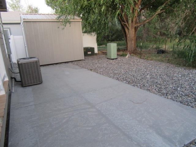 222 Holly Berry Way Fruita, CO 81521 - Photo 3 of 23 a view of two field with trees in front of it