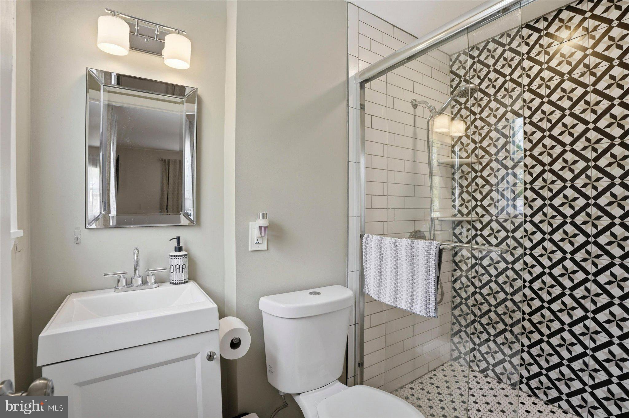 308 Lewis Road Springfield, PA 19064 - Photo 14 of 34 Stylish bathroom with modern accents.