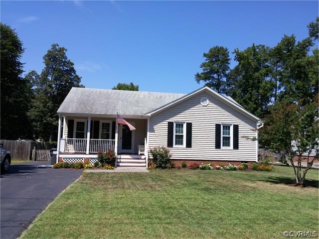 2528 London Road Henrico, VA 23233 - Photo 1 of 10 a front view of a house with a yard