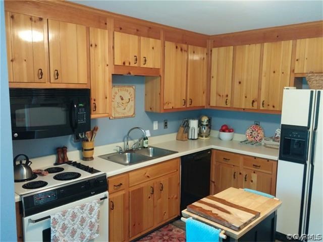2528 London Road Henrico, VA 23233 - Photo 4 of 10 a kitchen with a sink a stove and cabinets