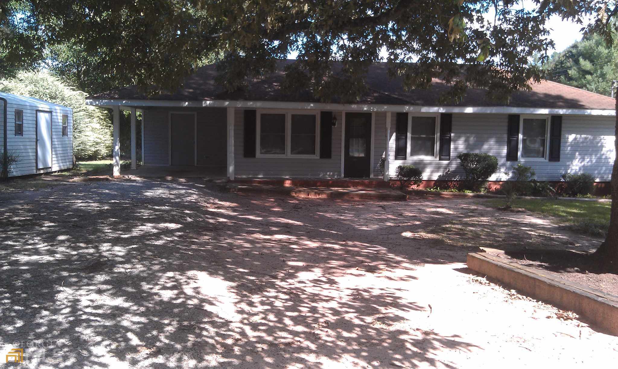 565 Womack Road Covington, GA 30016 - Photo 1 of 4 a view of a house with yard and sitting area