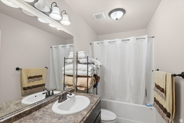 1084 South 740 East Logan, UT 84321 - Photo 11 of 23 Bathroom featuring vanity and shower / bath combo
