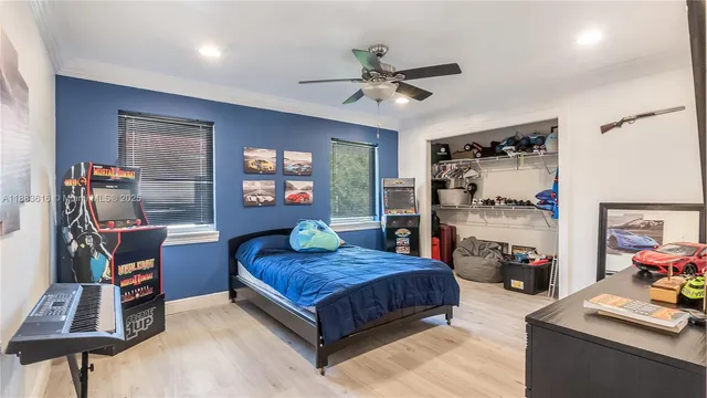 a bedroom with a bed and dresser