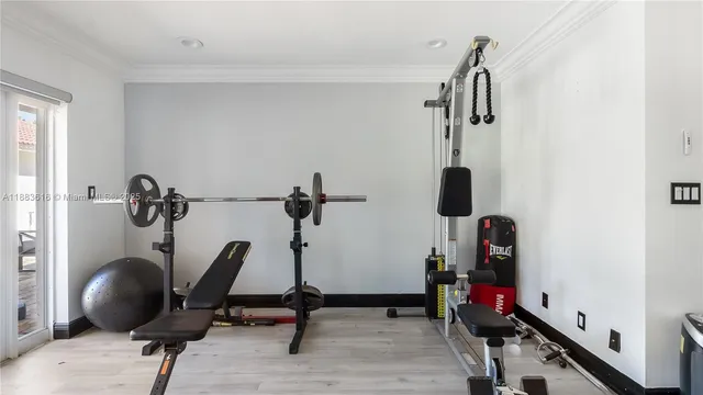a spacious bedroom with a bed and a chandelier