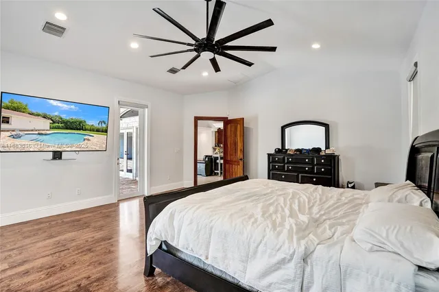 a large spacious bathroom with a tub sink and mirror