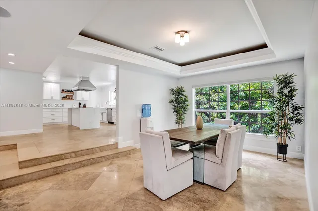 a workspace with furniture cabinet and a window