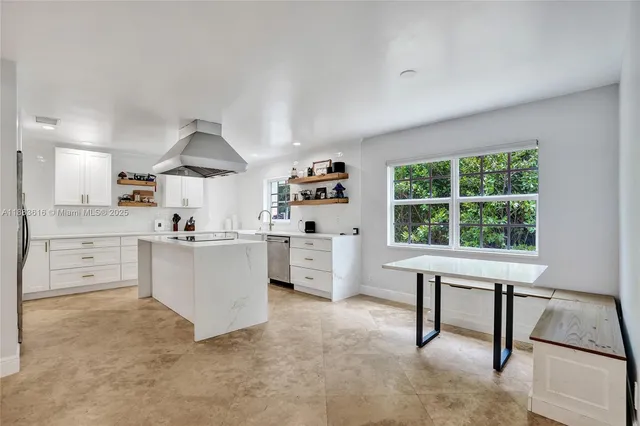 a kitchen that has a cabinets and a stove