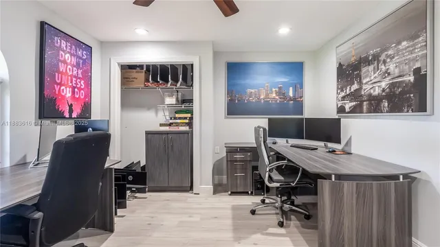 a view of room with window and ceiling fan